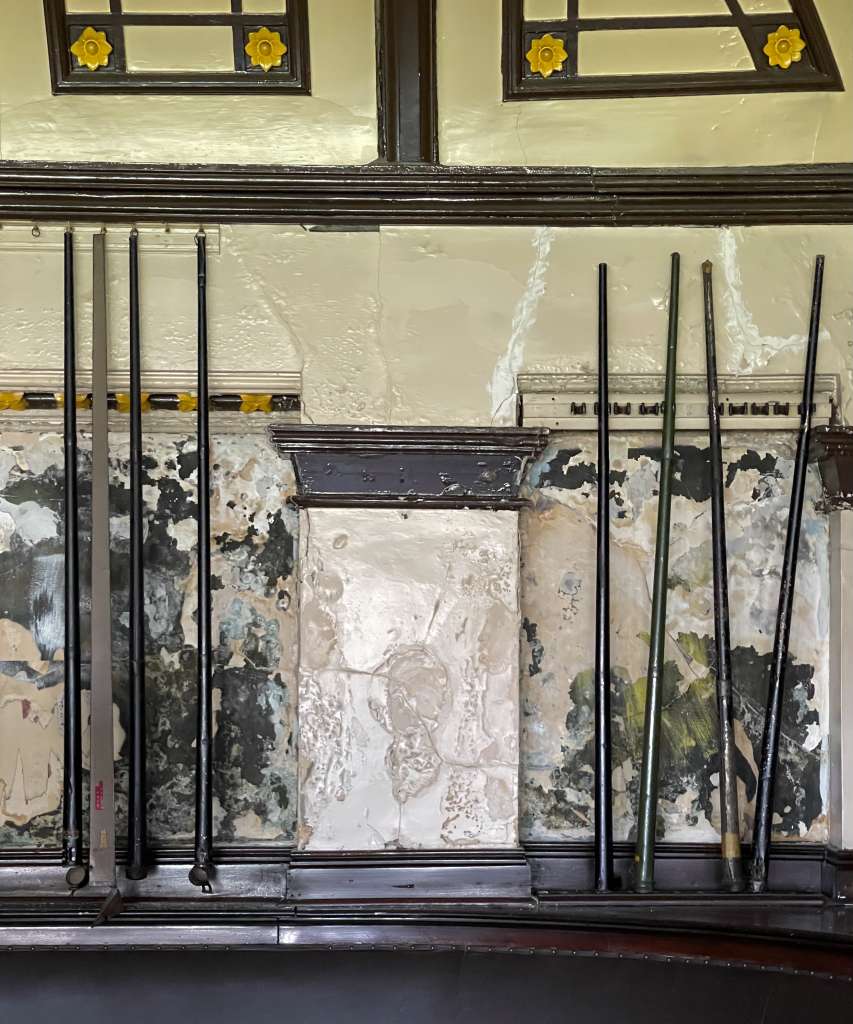 Original 19th century billiards cues still hang on the wall of the billiards room (M Watson))